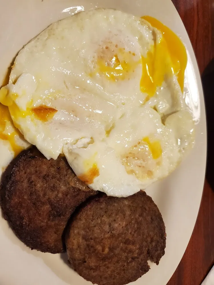 Three Eggs over Medium with Pancakes and Sausages